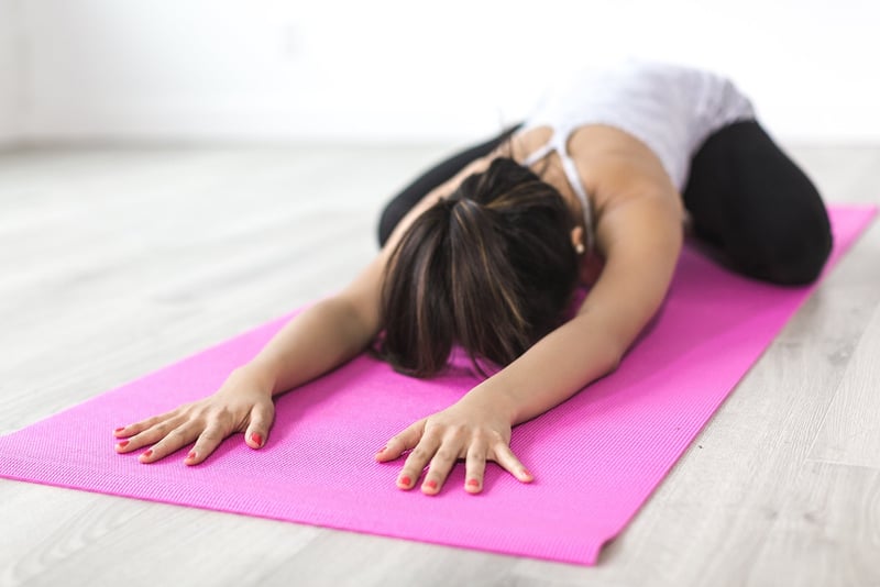 Woman meditating in a yoga pose